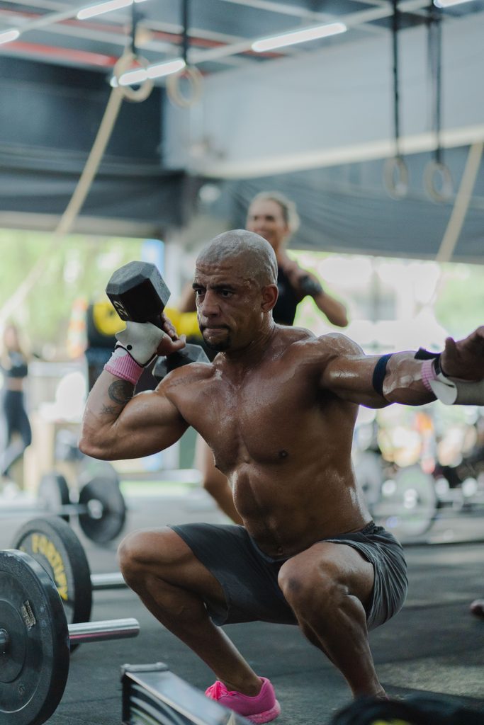 A man doing a Squat with a Dumbbell. Image from Pexels